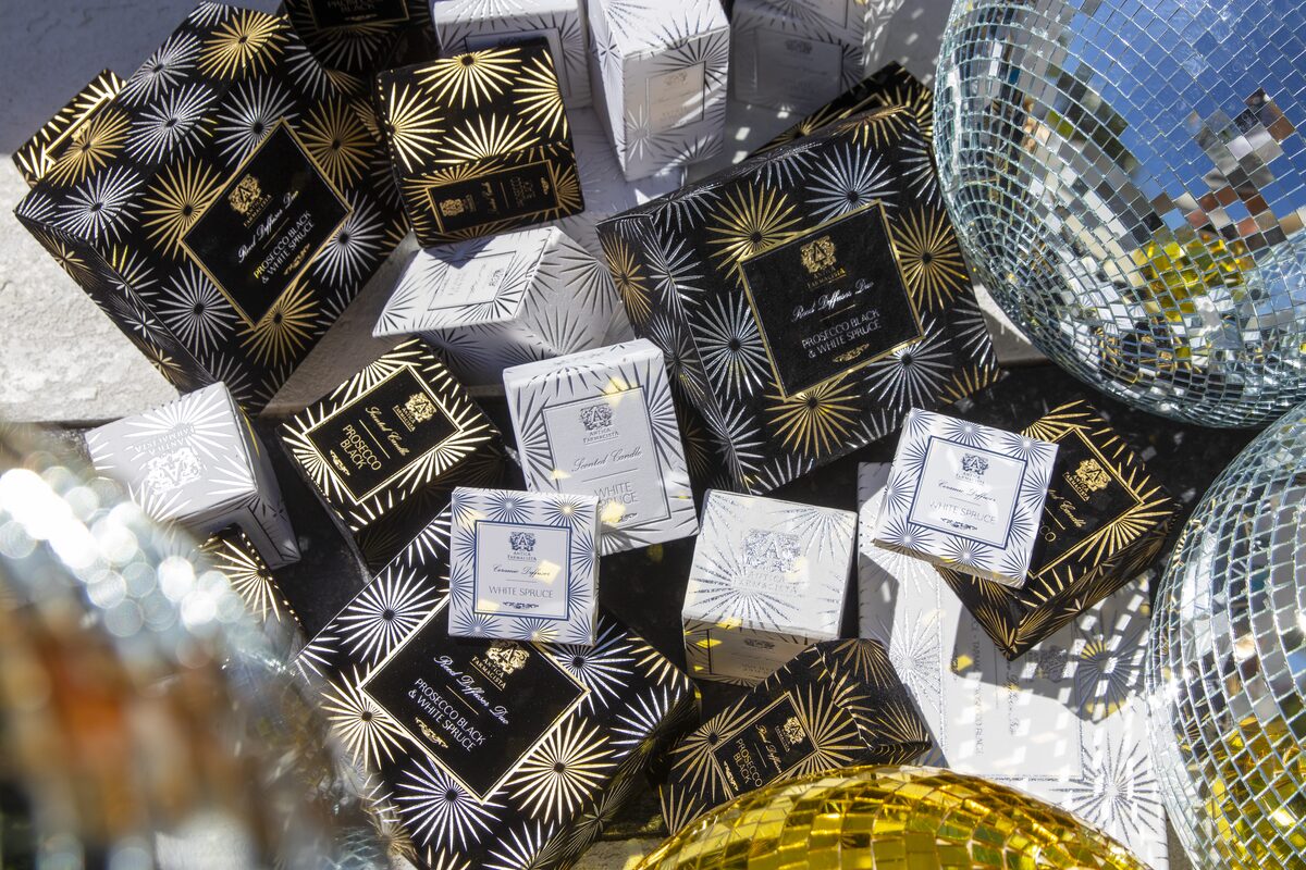 The gold and silver foiled starburst gift boxes tumbled together with disco balls.