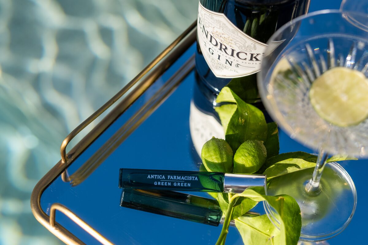 A mini propped with Hendrick’s, lime, and a coupe on the pool tray.